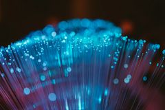 a bunch of fiberglas strings, glowing in blue
